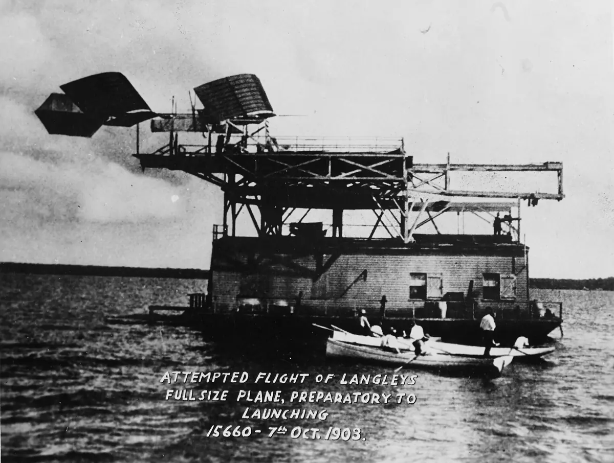 Langley’s tandem-winged Aerodrome perched on a catapult atop a houseboat in the Potomac.